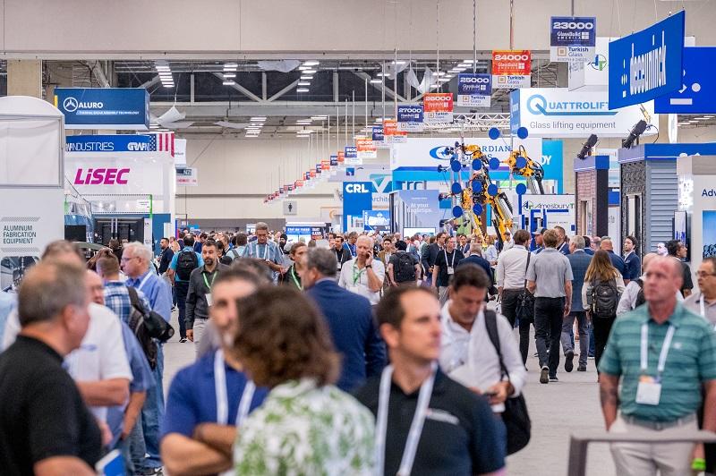 attendees walk the show floor